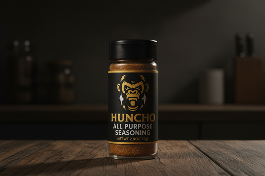 Huncho All Purpose Seasoning jar on a wooden surface with a dark background