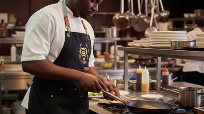 Chef in a professional kitchen preparing food